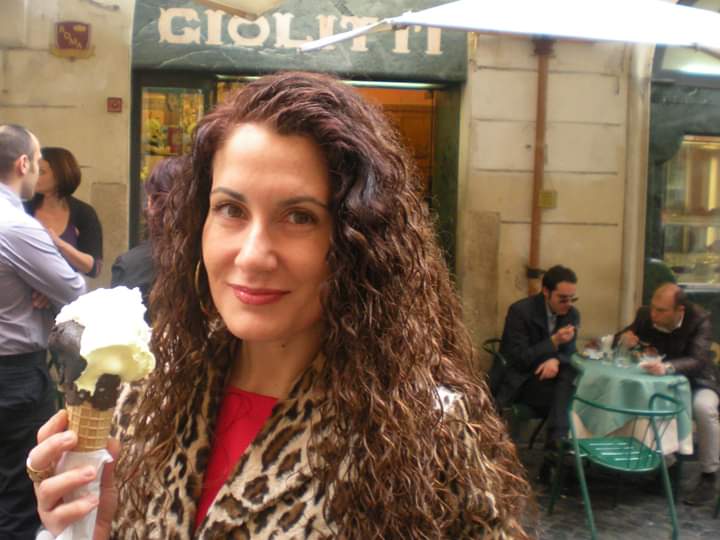Arietta @ariettastraveltips outside Giolitti, Rome,with a gelato in hand.