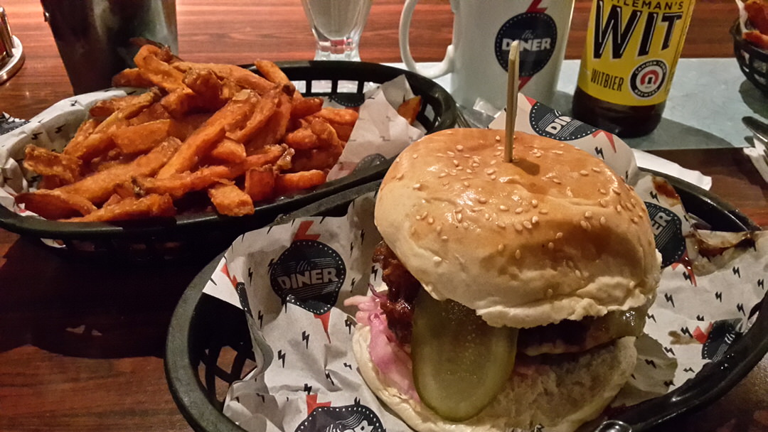 A delicious burger and sweet potato fries in The Diner Soho, London.
